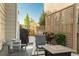 Inviting outdoor patio with comfortable seating, barbecue grill, and privacy fencing at 2907 Distant Rock Ave, Castle Rock, CO 80109