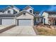 Charming two-story home with a two-car garage and inviting front porch at 147 Silver Rock Trl, Castle Rock, CO 80104