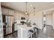 Modern kitchen featuring stainless steel appliances, quartz countertops, and a stylish center island at 147 Silver Rock Trl, Castle Rock, CO 80104