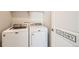 This laundry room includes new Maytag washer and dryer at 147 Silver Rock Trl, Castle Rock, CO 80104