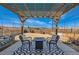 Relax on the back patio with a pergola. Sit around the gas firepit with friends at 147 Silver Rock Trl, Castle Rock, CO 80104