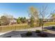 Backyard view with a well-maintained lawn and fencing, surrounded by trees at 10524 Eby Cir, Lone Tree, CO 80124
