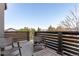 Balcony showcasing seating and views of lush trees and nearby homes at 10524 Eby Cir, Lone Tree, CO 80124