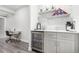 Chic bar area with a beverage cooler and desk for added convenience at 10524 Eby Cir, Lone Tree, CO 80124