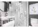 Bathroom featuring a modern shower with white marble tile, hexagon floor, and sleek fixtures at 10524 Eby Cir, Lone Tree, CO 80124