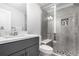 Bathroom featuring a shower with a built-in seat, sleek design, and modern fixtures at 10524 Eby Cir, Lone Tree, CO 80124