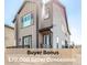 Stunning exterior elevation featuring a modern two-story home with a charming front porch and neutral color scheme at 10524 Eby Cir, Lone Tree, CO 80124