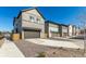 A row of modern homes with driveways, garages, and easy access to the street at 10524 Eby Cir, Lone Tree, CO 80124
