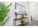 Bright hallway featuring stylish decor and leads to a modern bathroom at 10524 Eby Cir, Lone Tree, CO 80124