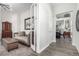 A well-designed living room offering open space into the dining room and stylish modern furniture at 10524 Eby Cir, Lone Tree, CO 80124