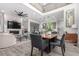 Open-concept space with fireplace, dining area, and kitchen, great for entertaining guests at 10524 Eby Cir, Lone Tree, CO 80124