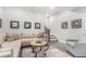 Living room showcasing a comfortable seating area, with gray flooring and artwork at 10524 Eby Cir, Lone Tree, CO 80124