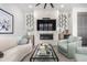 Comfortable living room showcasing a stylish fireplace, modern decorations, and a sleek glass coffee table at 10524 Eby Cir, Lone Tree, CO 80124