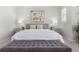 Cozy main bedroom showcasing neutral tones, comfortable bed, and decorative accents at 10524 Eby Cir, Lone Tree, CO 80124