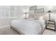 Inviting bedroom featuring plantation shutters, ample natural light, and neutral decor at 10524 Eby Cir, Lone Tree, CO 80124