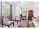 A home office with a desk, seating area, and balcony to the outside at 10524 Eby Cir, Lone Tree, CO 80124