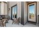 Cozy patio with seating area next to a well-maintained modern home entrance at 10524 Eby Cir, Lone Tree, CO 80124