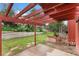 Backyard view of a patio, lawn and terraced landscaping, offering a serene outdoor retreat at 6293 Ponderosa Way, Parker, CO 80134