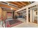 Unfinished basement space with walkout access and exposed ceiling at 6293 Ponderosa Way, Parker, CO 80134