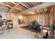 Unfinished basement with exposed ceiling, concrete floor and space for storage and projects at 6293 Ponderosa Way, Parker, CO 80134