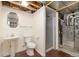 Unfinished bathroom with shower, pedestal sink, and plank flooring at 6293 Ponderosa Way, Parker, CO 80134