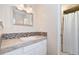 Bathroom with updated fixtures, stylish vanity, and tiled shower at 6293 Ponderosa Way, Parker, CO 80134