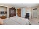 Well-lit bedroom with neutral tones and elegant furniture at 6293 Ponderosa Way, Parker, CO 80134