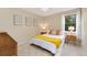 Inviting bedroom filled with natural light, soft carpeting, and traditional furniture at 6293 Ponderosa Way, Parker, CO 80134