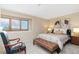 Serene bedroom features a large window and neutral decor for a peaceful retreat at 6293 Ponderosa Way, Parker, CO 80134