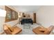 Comfortable living area with plush seating and a modern glass coffee table at 6293 Ponderosa Way, Parker, CO 80134