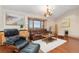 Inviting living room showcasing hardwood floors and natural light, perfect for relaxation at 6293 Ponderosa Way, Parker, CO 80134