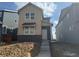 Newly built two-story home with a mix of modern materials and a welcoming entrance at 23772 E 33Rd Pl, Aurora, CO 80019