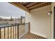 Balcony features wood plank flooring and a metal railing at 6009 Yarrow St # B, Arvada, CO 80004