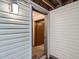 Unfinished basement with open doorway, showing exposed beams and concrete floors at 6009 Yarrow St # B, Arvada, CO 80004