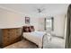 Comfortable bedroom with ample natural light, a classic dresser, and a calming neutral color palette at 6009 Yarrow St # B, Arvada, CO 80004