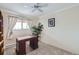 Bright bedroom with a dedicated desk space, natural light, and simple decor for a peaceful environment at 6009 Yarrow St # B, Arvada, CO 80004
