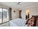 Inviting bedroom with a private balcony, ensuite bathroom, and soft, neutral tones for a relaxing retreat at 6009 Yarrow St # B, Arvada, CO 80004