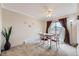 Bright dining area featuring a modern ceiling fan and a sliding glass door at 6009 Yarrow St # B, Arvada, CO 80004