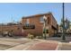 Charming School House Kitchen & Libations building featuring a brick facade, lush greenery and inviting streetscape at 6009 Yarrow St # B, Arvada, CO 80004