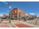 An exterior view of the AL.Davis Block landmark building on a sunny day in Wheat Ridge at 6009 Yarrow St # B, Arvada, CO 80004