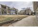 Apartment buildings feature individual balconies and well-maintained lawns at 6009 Yarrow St # B, Arvada, CO 80004