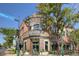 HomeGrown Tap & Dough exterior with large windows, dark awning and outdoor seating at 6009 Yarrow St # B, Arvada, CO 80004