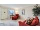 Cozy living room featuring a large window offering great natural light at 6009 Yarrow St # B, Arvada, CO 80004
