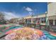 A vibrant street mural adds color and charm to this street with walkable retail fronts and community gathering space at 6009 Yarrow St # B, Arvada, CO 80004