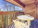 Cozy balcony with mountain views featuring a table and chairs, ideal for relaxation at 305 S Park Ave # 402, Breckenridge, CO 80424