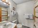 Neutral bathroom with a vanity, toilet and shower/tub combo with striped shower curtain at 305 S Park Ave # 402, Breckenridge, CO 80424