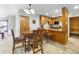 Open concept kitchen with wooden cabinets and a breakfast bar with seating at 305 S Park Ave # 402, Breckenridge, CO 80424