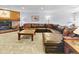 Spacious living area featuring a fireplace, large sofa, and views of the exterior at 305 S Park Ave # 402, Breckenridge, CO 80424