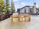 Outdoor stone kitchen area with grill and storage at 305 S Park Ave # 402, Breckenridge, CO 80424