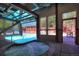 Bright indoor pool and hot tub area with retractable glass roof leading to outdoor pool at 305 S Park Ave # 402, Breckenridge, CO 80424